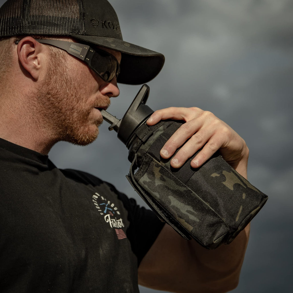 Iron Infidel Battle Bottle - Half Gallon Insulated Water Bottle with Paracord Handle, Large 64 oz Stainless Steel Water Jug with Rugged, Removable Sleeve for Keys, Wallet, & Phone (Live Free 2 Liter)